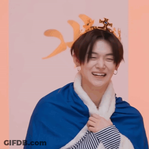 Young Korean Man In Crown And Cape Smiling GIF