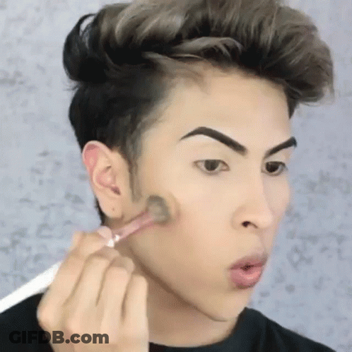 Young Man Applying Makeup GIF