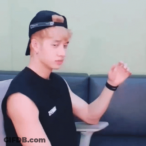 Young Man Baseball Cap Black Tank Top Sitting Chair GIF