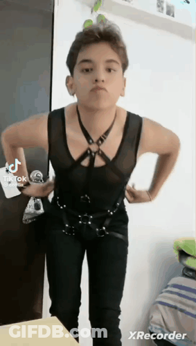 Young Man Black Vest Pants Hands On Hips GIF