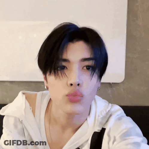 Young Man Blowing Kiss GIF
