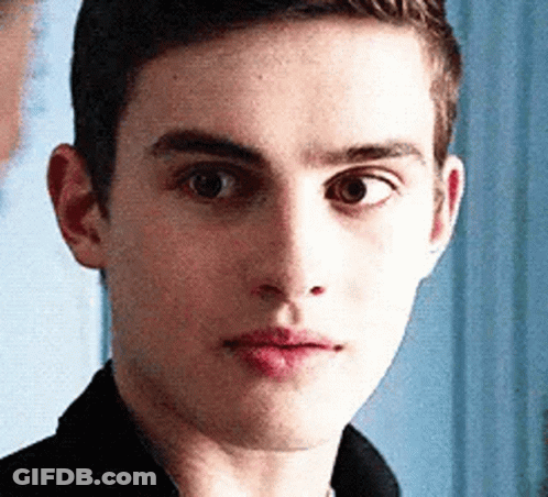Young Man Close Up Blue Background GIF