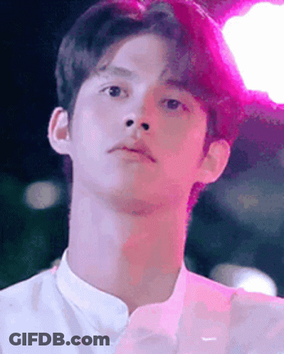 Young Man Close-Up Pink Background GIF