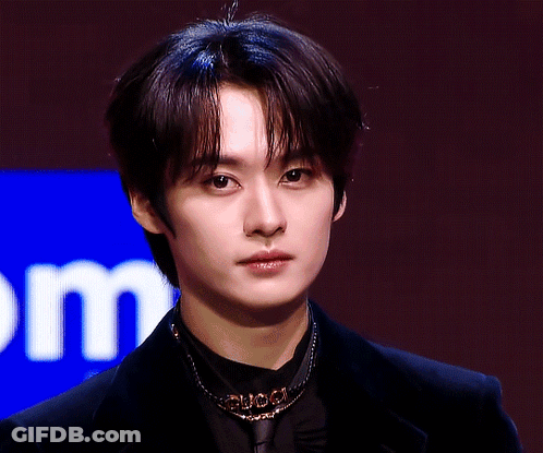 Young Man Close Up With Letter M GIF
