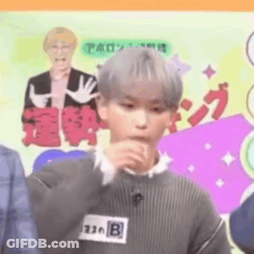 Young Man Covering Mouth GIF