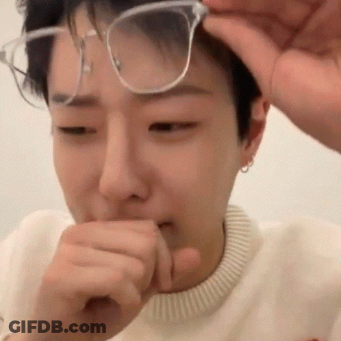 Young Man Covering Mouth With Hand GIF