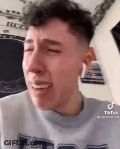 Young Man Crying Eyes Closed Grey Shirt GIF