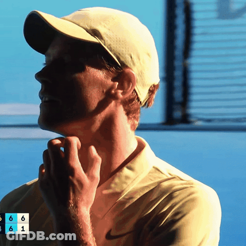 Young Man Curly Hair Looking At Camera Dark Room GIF