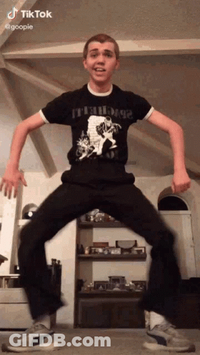 Young Man Dancing In Living Room GIF