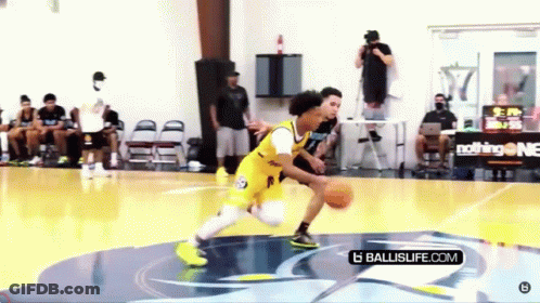 Young Man Dribbling Basketball On Court GIF