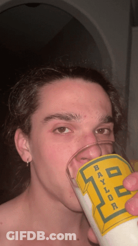 Young Man Drinking From Baylor Glass GIF