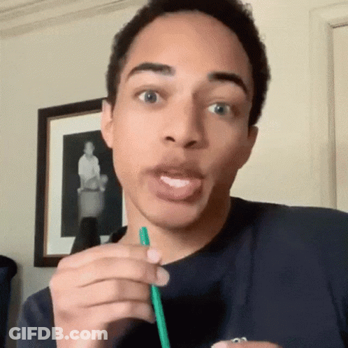 Young Man Drinking Through Green Straw Making Funny Face GIF