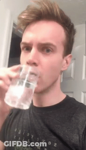 Young Man Drinking Water From Glass GIF