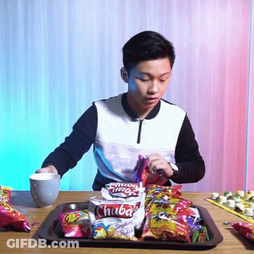Young Man Eating Bag Of Chuba Potato Chips GIF