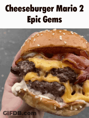Young Man Eating Large Hamburger With Sesame Seeds GIF