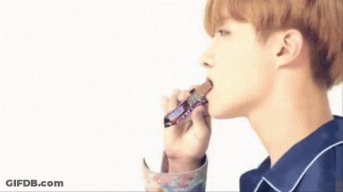 Young Man Eating Snickers Bar GIF