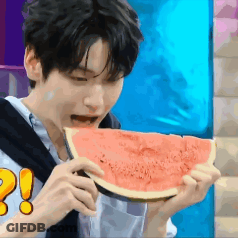 Young Man Eating Watermelon With Exclamation Point GIF
