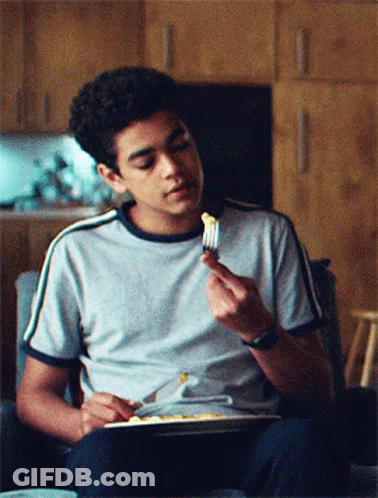 Young Man Eating With Fork GIF