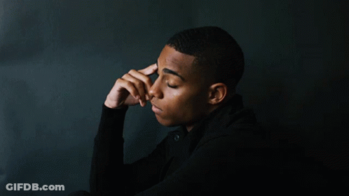 Young Man Hand To Forehead Looking Down GIF