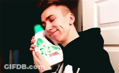 Young Man Holding Ariel Detergent GIF
