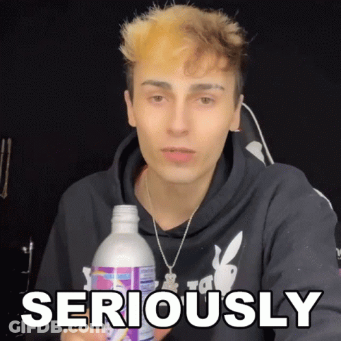 Young Man Holding Bottle Saying Seriously GIF