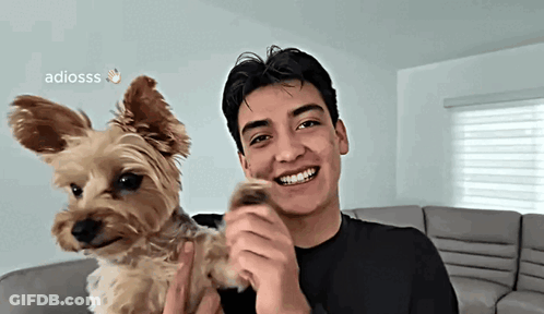 Young Man Holding Brown Dog Smiling Adiosss GIF