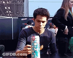 Young Man Holding Can Of Soda GIF