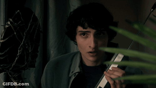 Young Man Holding Cell Phone GIF