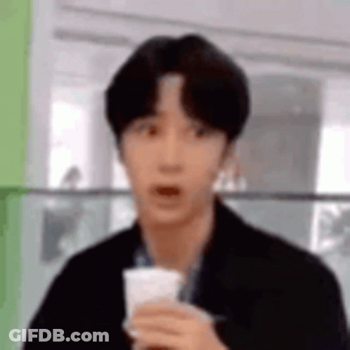 Young Man Holding Coffee Surprised GIF