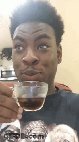 Young Man Holding Cup Of Coffee GIF