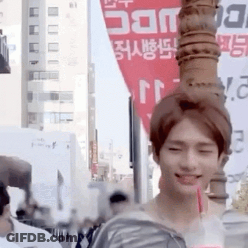 Young Man Holding Drink Smiling GIF