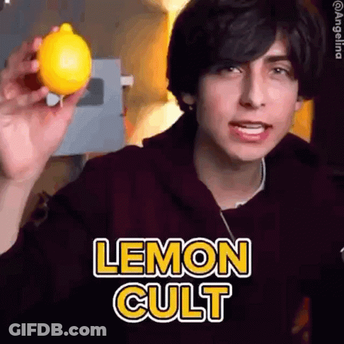 Young Man Holding Lemon With Lemon Cult Text GIF