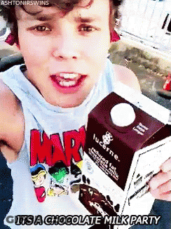 Young Man Holding Lucerne Milk GIF