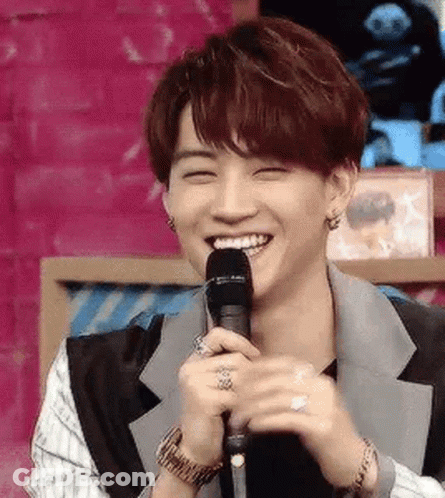 Young Man Holding Microphone Smiling GIF