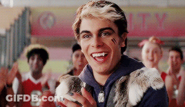 Young Man Holding Rabbit Smiling At Crowd GIF