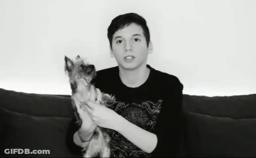 Young Man Holding Small Dog GIF