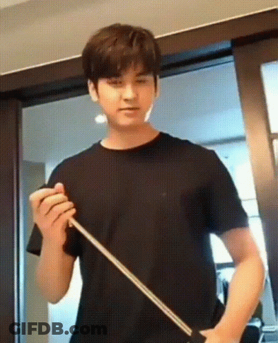 Young Man Holding Stick At Sliding Door GIF