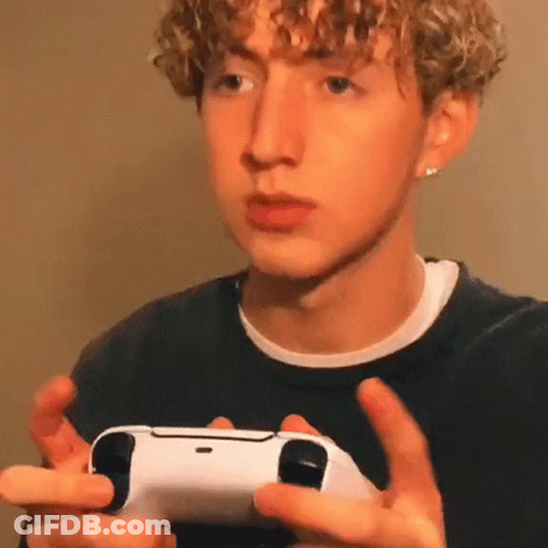 Young Man Holding Video Game Controller GIF