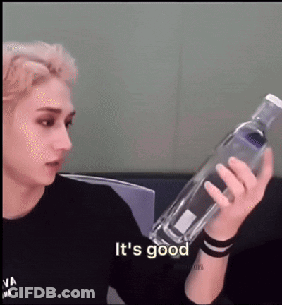 Young Man Holding Water Bottle Saying It's Good GIF