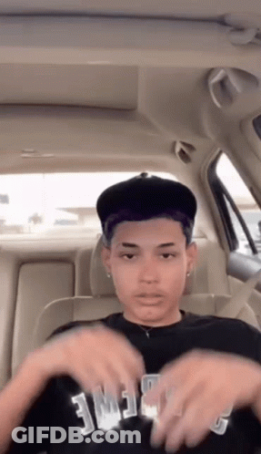 Young Man In Back Seat Wearing Fame Shirt GIF