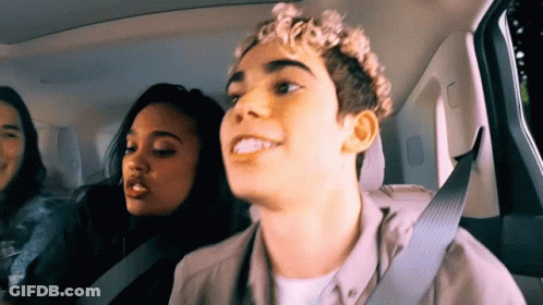 Young Man In Back Seat With Two Women GIF