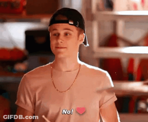 Young Man In Baseball Cap And Heart T-Shirt GIF