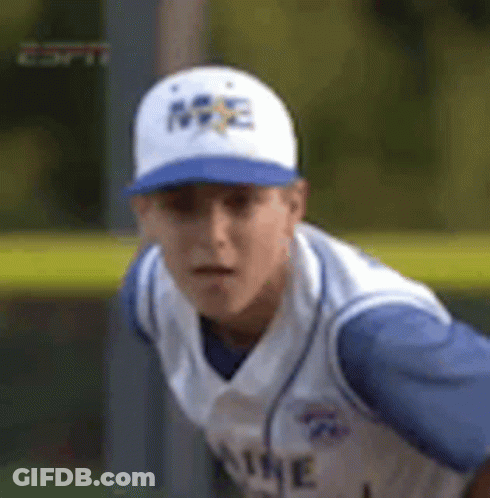Young Man In Baseball Cap And Jersey On Field GIF