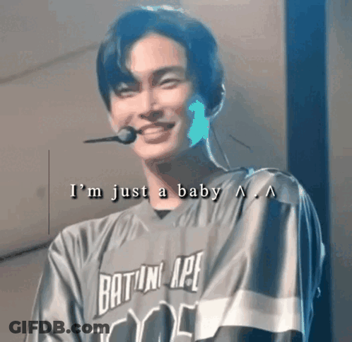 Young Man In Baseball Jersey Smiling With Microphone GIF