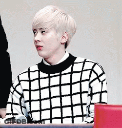 Young Man In Black And White Checkered Sweater GIF