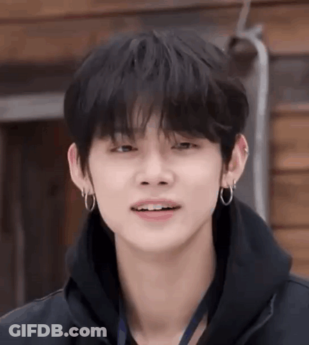 Young Man In Black Hoodie And Earrings GIF