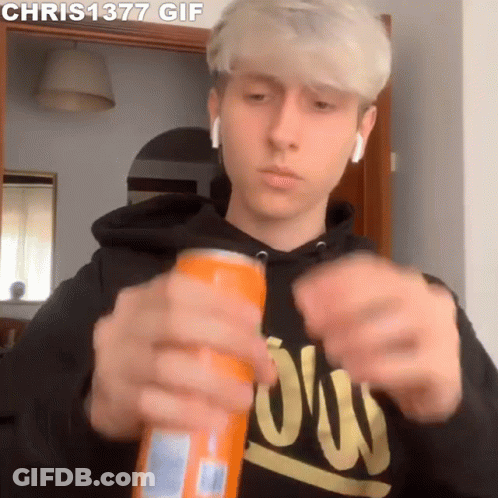 Young Man In Black Hoodie Opening Orange Soda Can GIF