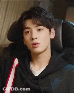 Young Man In Black Hoodie Sitting In Chair GIF