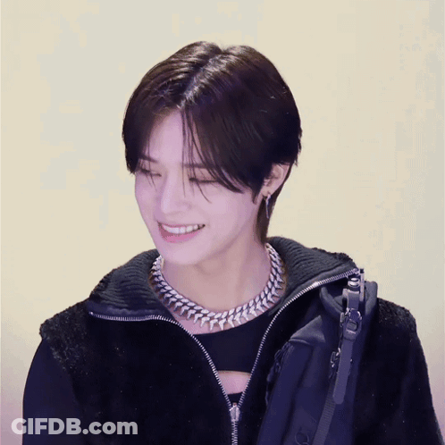 Young Man In Black Jacket And Chain Smiling GIF