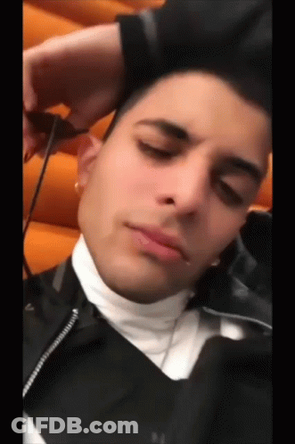 Young Man In Black Jacket Resting Head GIF